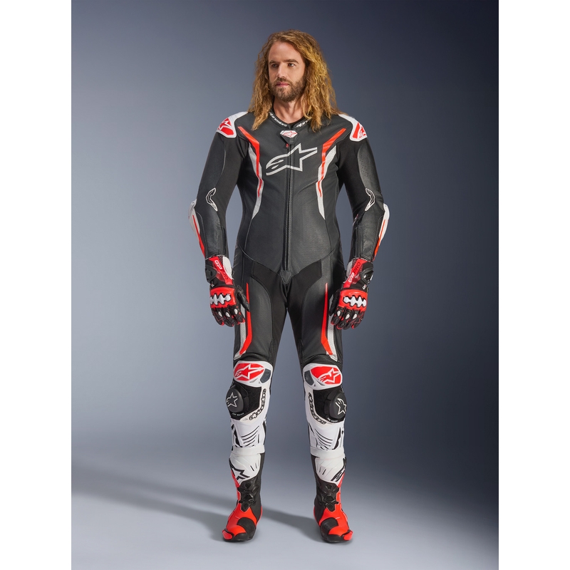 Tuta da moto intera in pelle Alpinestars GP TECH V5, nera, bianca e rosso fluo.