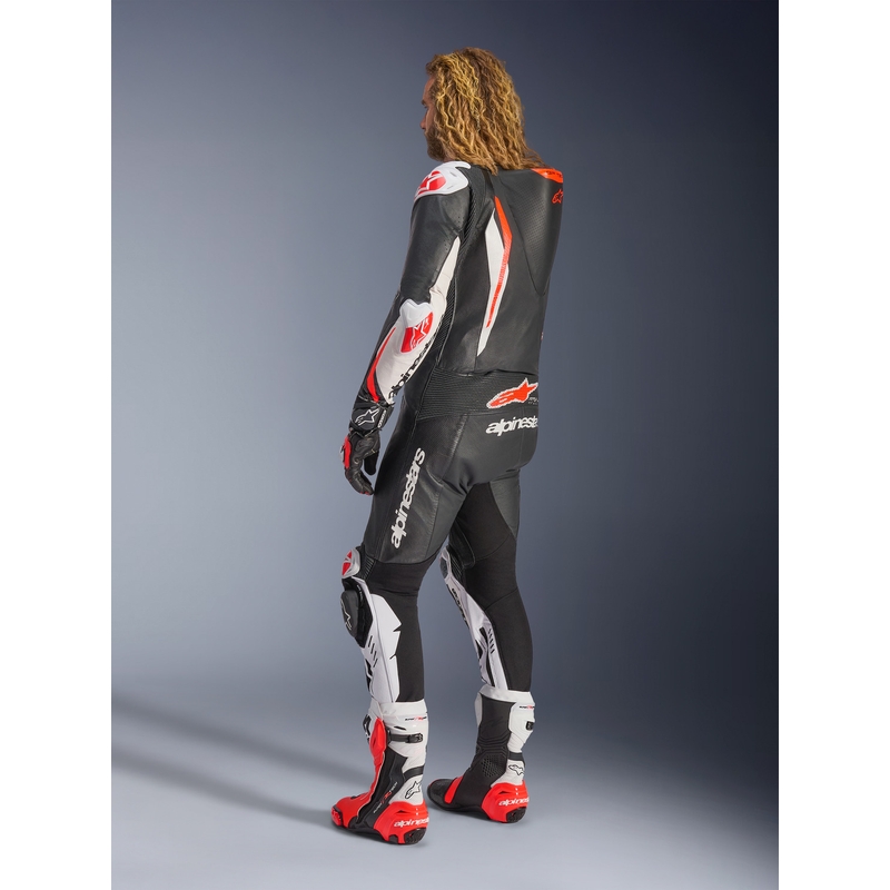Tuta da moto intera in pelle Alpinestars GP TECH V5, nera, bianca e rosso fluo.