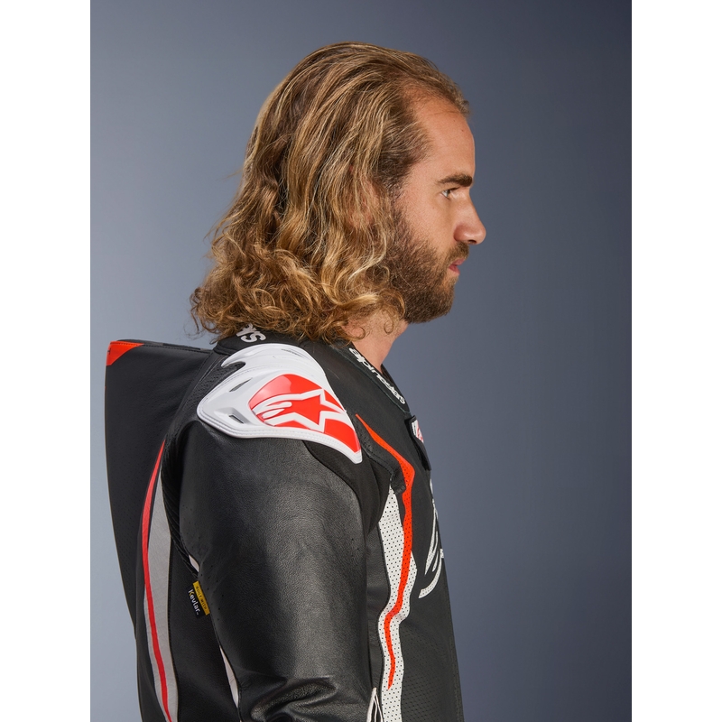 Tuta da moto intera in pelle Alpinestars GP TECH V5, nera, bianca e rosso fluo.
