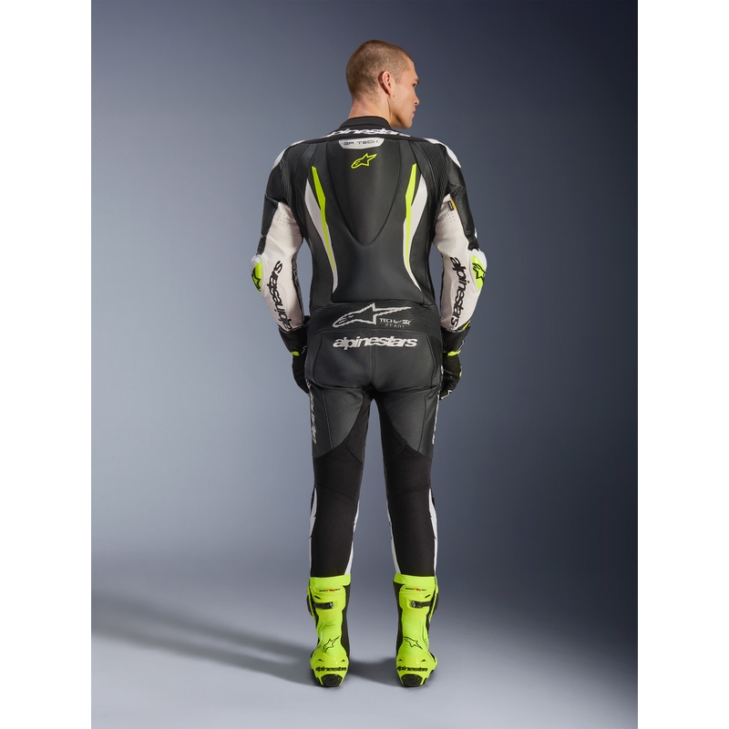 Tuta da moto intera in pelle Alpinestars GP TECH V5, nera, bianca e giallo fluo.