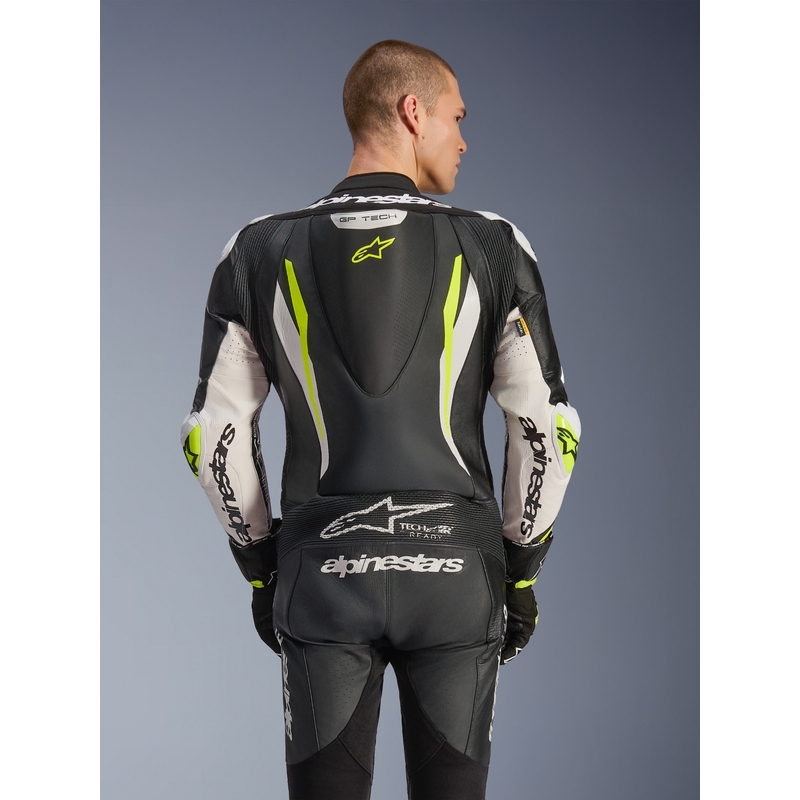 Tuta da moto intera in pelle Alpinestars GP TECH V5, nera, bianca e giallo fluo.
