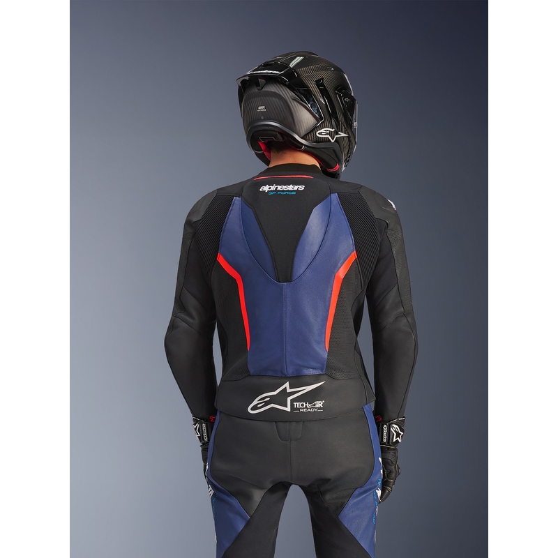 Tuta da moto Alpinestars GP Force V2 a due pezzi, nera, blu e rosso fluo.