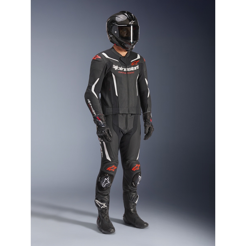 Tuta in pelle Alpinestars GP Force V2 a due pezzi, nera, bianca e rosso fluo.