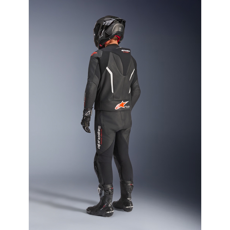 Tuta in pelle Alpinestars GP Force V2 a due pezzi, nera, bianca e rosso fluo.