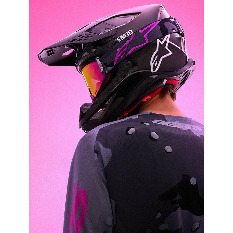 Occhiali da motocross Alpinestars Supertech Lone viola mimetici con lenti in plexiglass rosa a specchio.