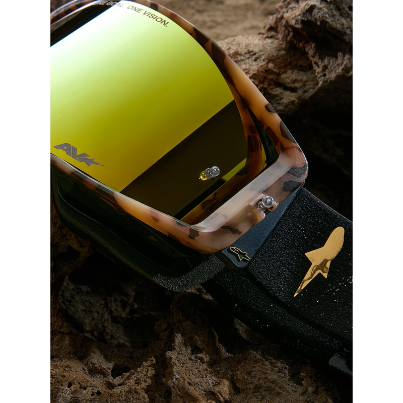 Occhiali da motocross Alpinestars Supertech Zona edizione limitata, neri e marroni con plexiglass a specchio color oro.